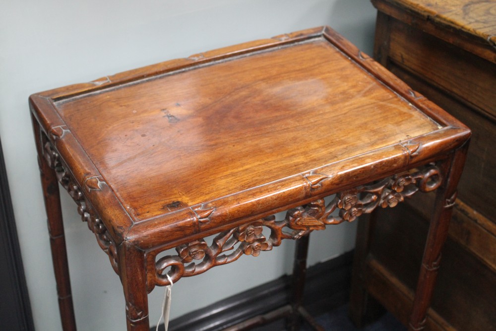 A nest of four 19th century Chinese carved pierced hardwood tables, W.50cm D.36cm H.71cm